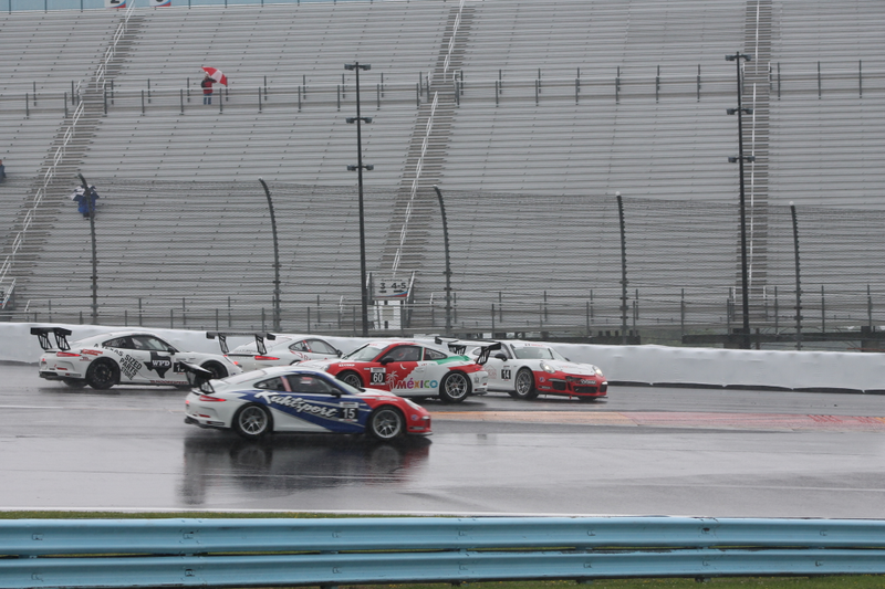 Illustration for article titled Standing Water Causes Mass 911 GT3 Cup Spin-Out At First Turn Of Race